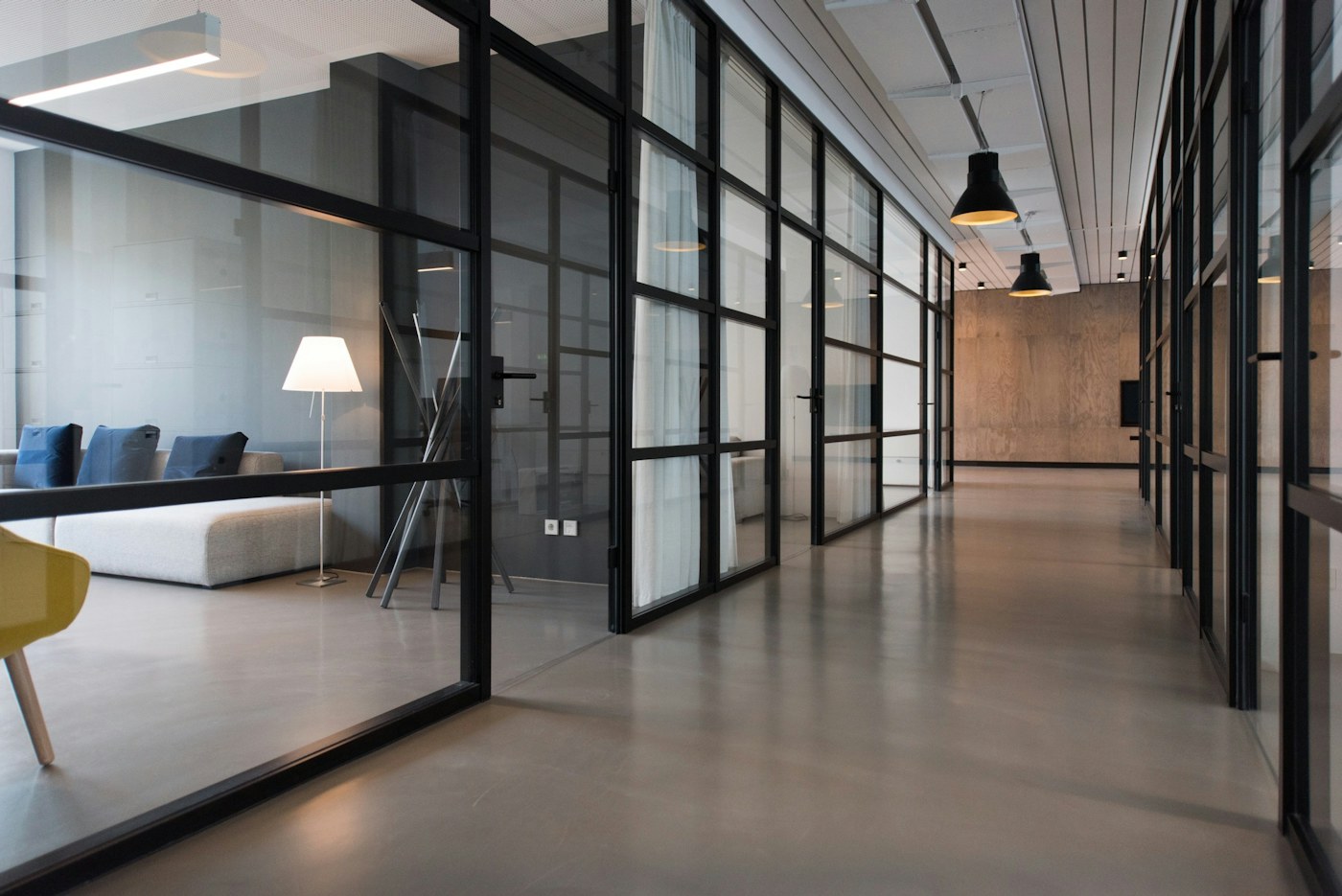 Polished modern commercial office corridor and shared workspace